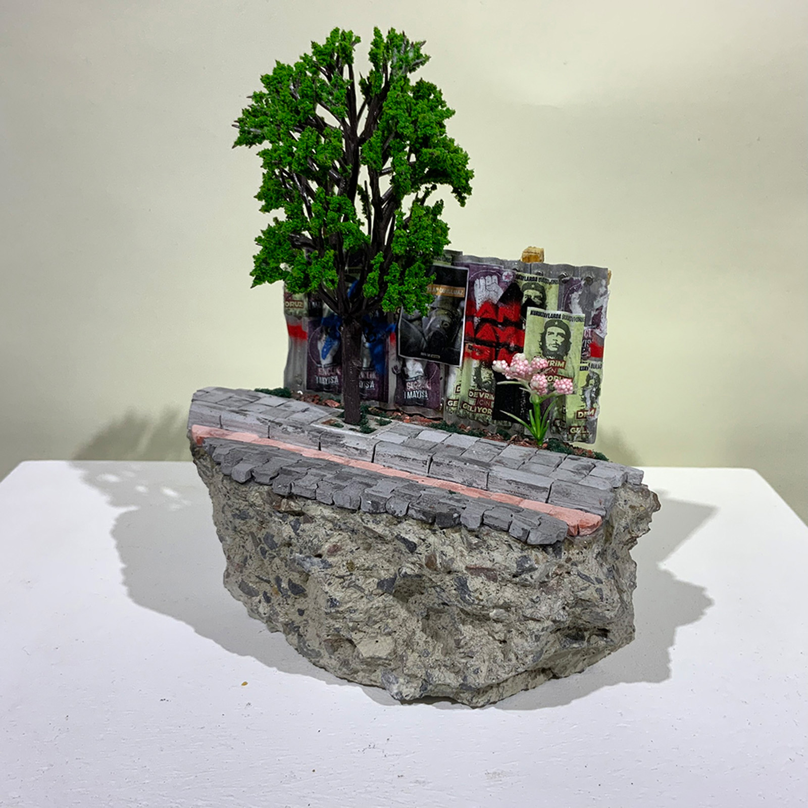 A small-scale sculpture of street hoarding from On the Rubble of Our Ancestors
