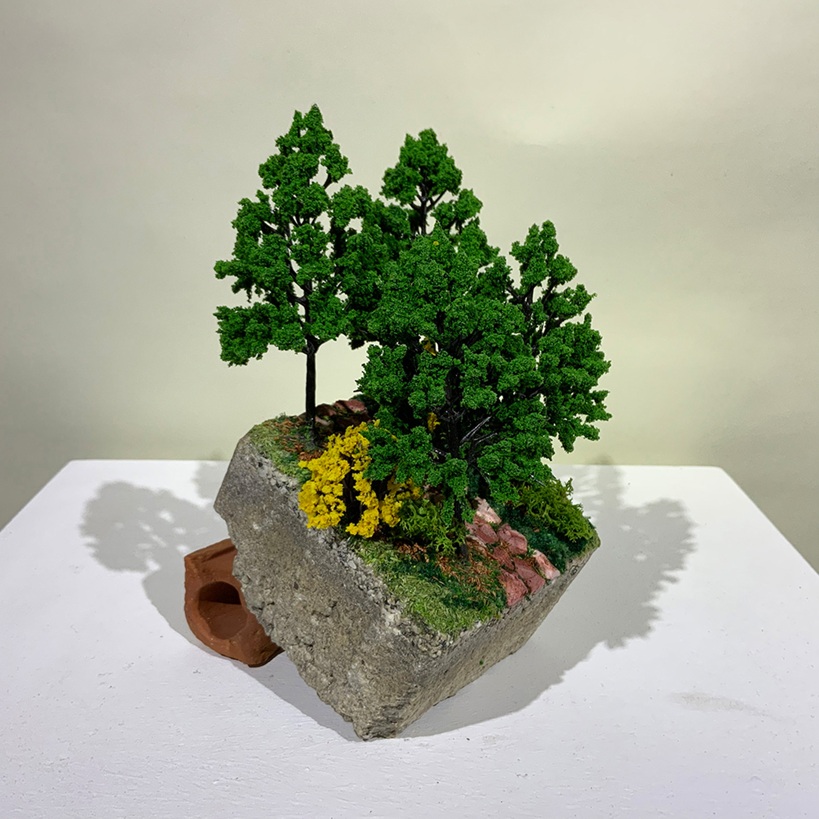 A small-scale sculpture of a steep hillside path from On the Rubble of Our Ancestors