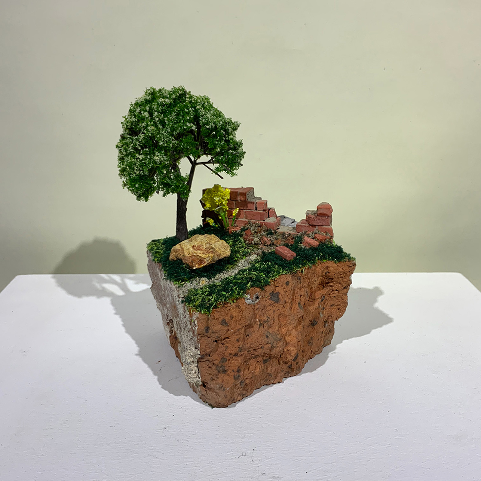 A small-scale sculpture of a shortcut through a landscape from On the Rubble of Our Ancestors